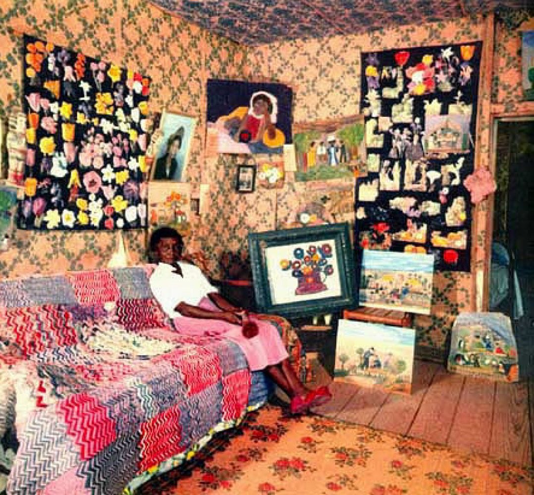 Artwork Title: Clementine Hunter in her cabin with her first oil painting, 