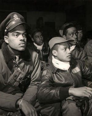 Artwork Title: Members of the elite all black Tuskegee airmen 332nd fighter group attending a brief meeting in Rami