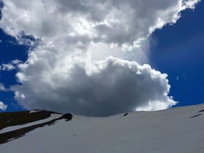 Artwork Title: Clouds billow above the ridgeline leading to Montana’s Hyalite Peak