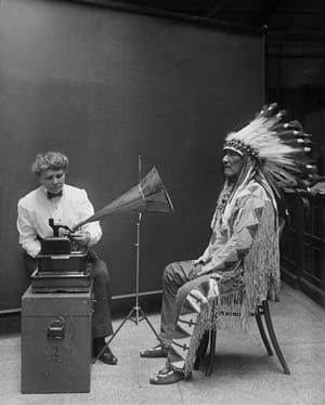 Artwork Title: Frances Densmore recording the music of a Blackfoot chief onto a phonograph