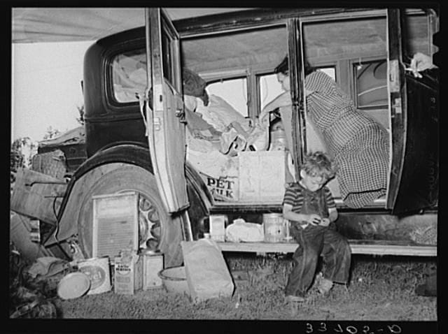Artwork Title: Belongings of migrant family packed in and around car near Muskogee, Oklahoma. Muskogee County