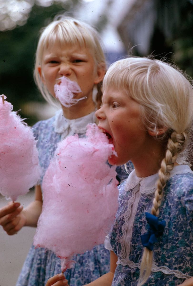 Artwork Title: Girls Eat Large Swirls Of Cotton Candy In Copenhagen, Denmark, January 1963.