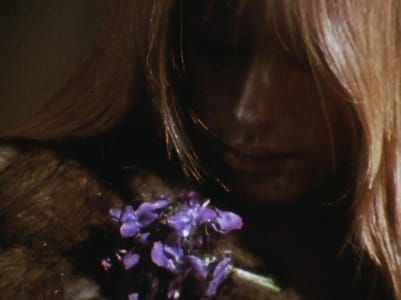 Artwork Title: Lilith (Marianne Faithfull) with flowers. A still from Lucifer Rising