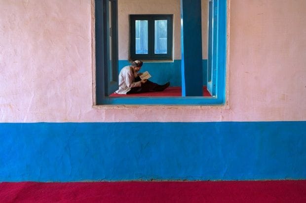 Artwork Title: Man reads at Mosque