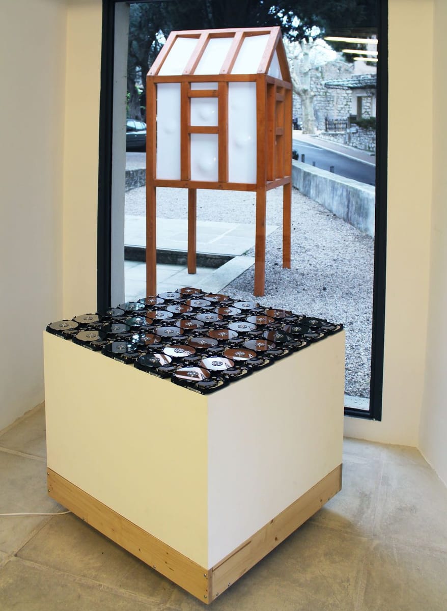 Artwork Title: 35 Hard drive speakers playing the voice record of their own title expanded to the lenght of the exh
