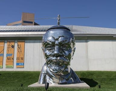 Artwork Title: Miss Mao trying to Poise herself on the head of Lenin