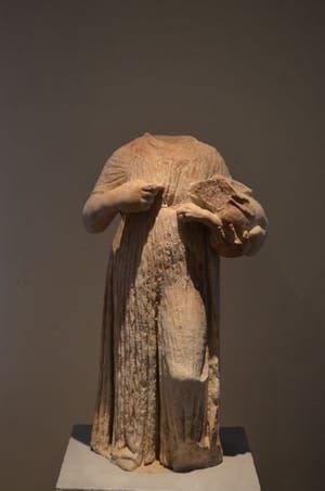 Artwork Title: A votive statue of a little girl holding a hare