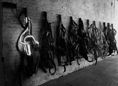 Artwork Title: Belts (Vulcanized rubber, and neon tubing)